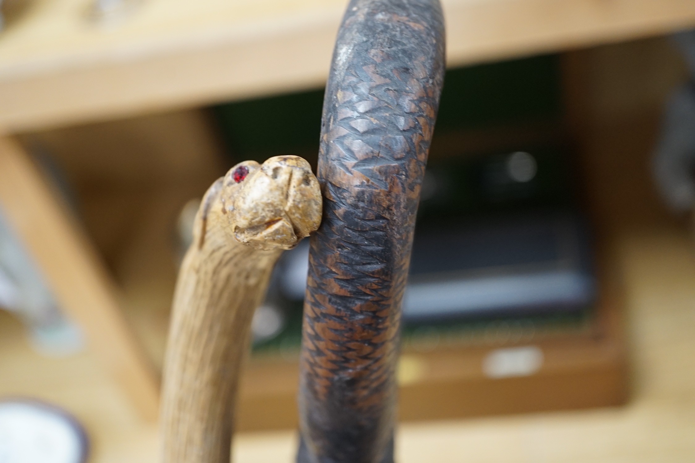 An African carved wood walking cane and a ‘dogs head’ walking cane